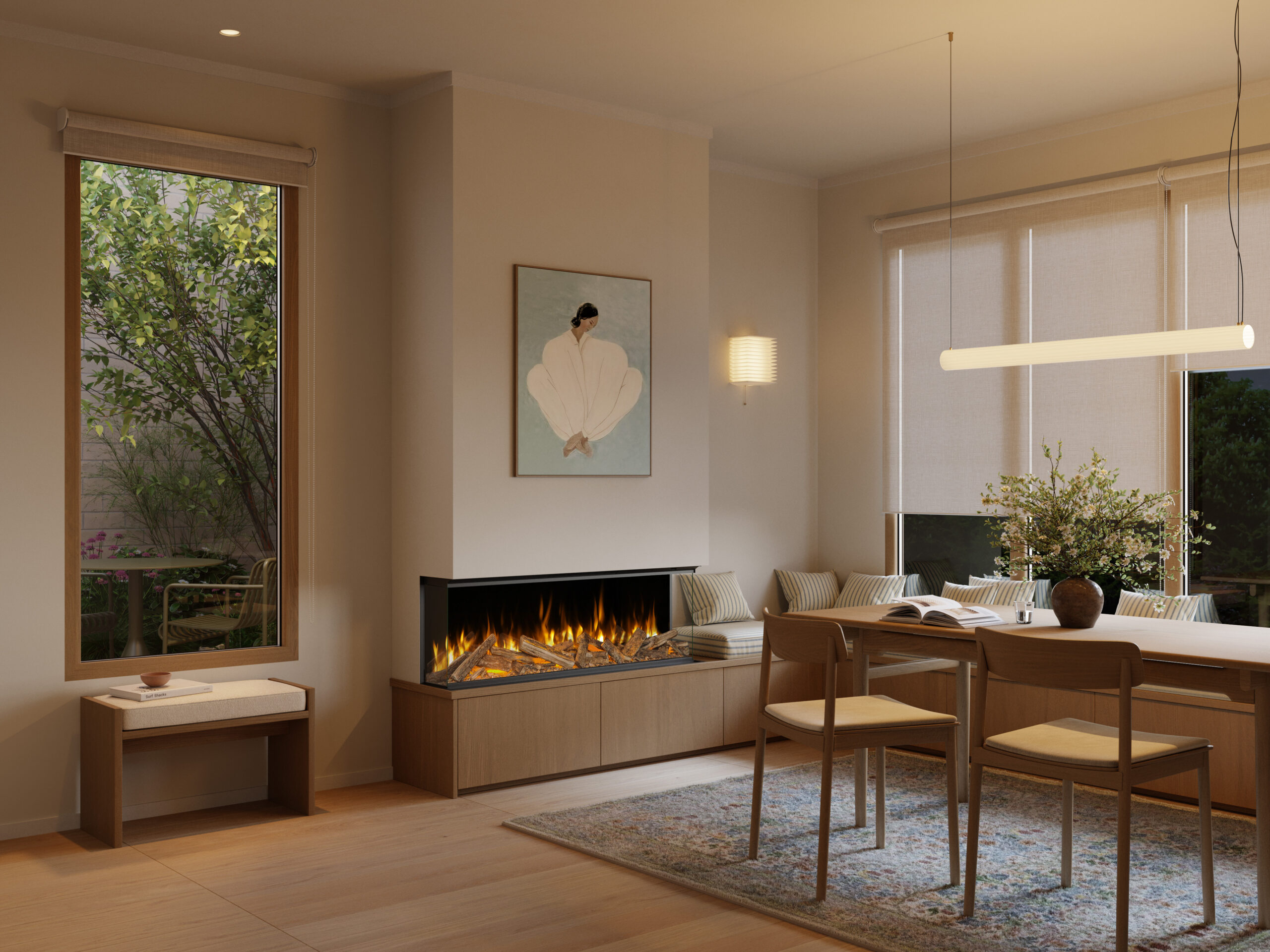 Volektra electric media wall fire with realistic flames and log effect, installed beneath a TV in a modern open-plan dining and living space.